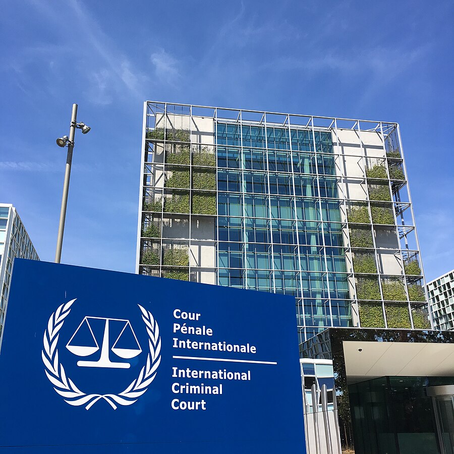 Photo of the International Criminal Court building with sign