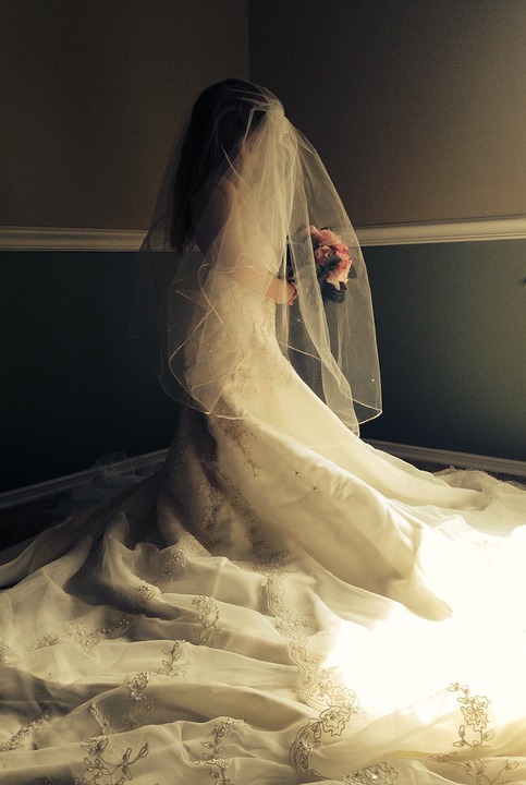 Image of young girl wearing wedding dress