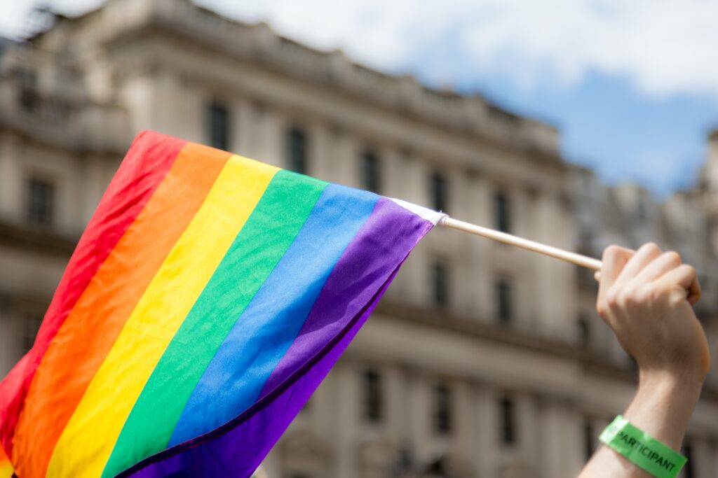 Image of LGBTQ flag flying in front of court building
